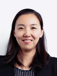 A close-up of a person smilingDescription automatically generated